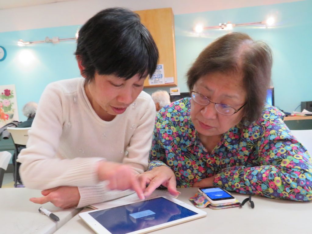 Wanda teaches digital literacy skills to Excelsior senior