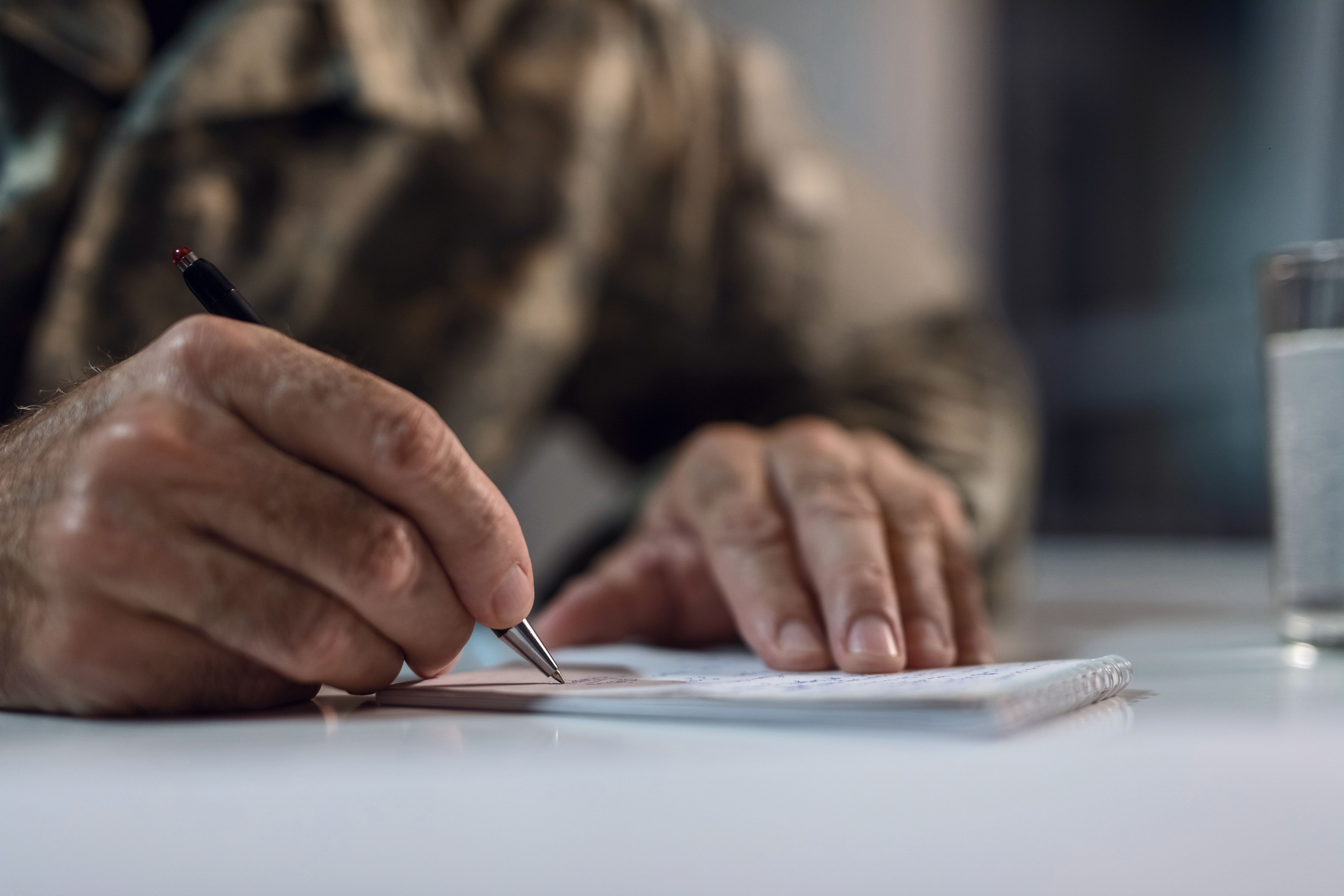 close up of older man writing