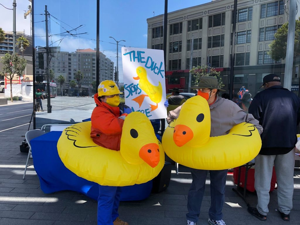 two people in duck inner tubes