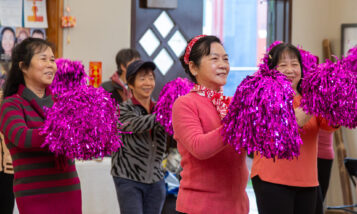 Neighbors demonstrate Chinese dance