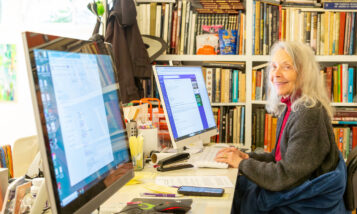 Woman ReServist working on a computer at ThinkRound