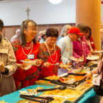 CLC neighbors and staff enjoy potluck dishes as part of the Good Neighbor celebration
